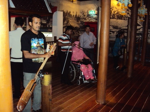 Roosevelt Benjamin D'Rozario of Bangladesh interacts with a paddling exhibit. 