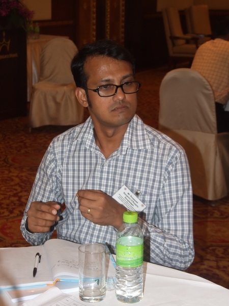 Roosevelt Benjamin D'Rozario of Bangladesh sits at a table. 