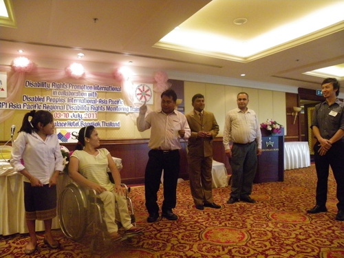 Participants from Nepal, Bangladesh, Camboadia and Laos gather together to sing, dance and clap during the closing ceremony. 