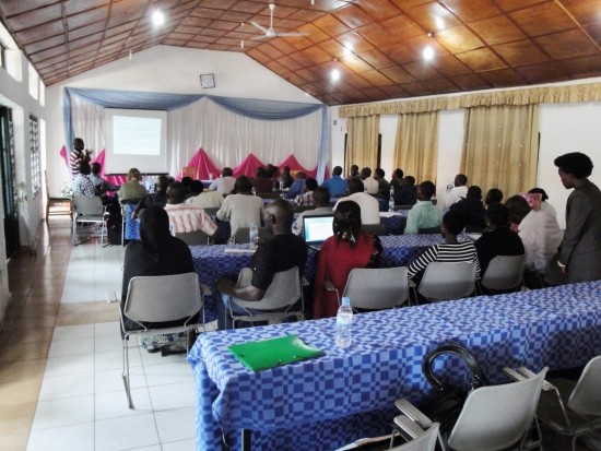 <p>
	Mr. Oswald BURASANZWE is at the front of a lecture room, facing a screen showing a powerpoint presentation on the Prime Minister&#39;s Order determining the responsibilities, organization and functioning of the Organs of the National Council of persons with disabilities in Rwanda. Participants are sitting in rows of tables, facing the presenter.</p>
