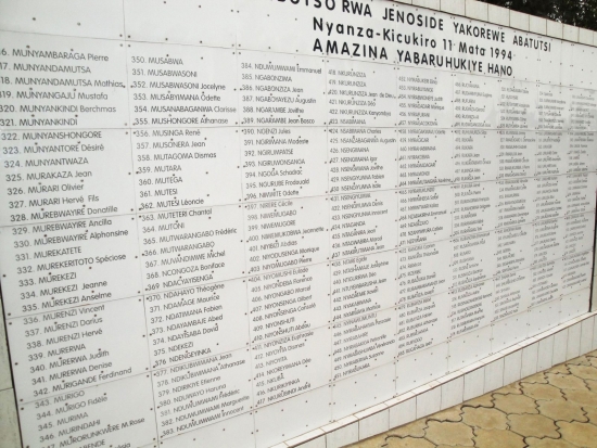 A large white wall lists many names.