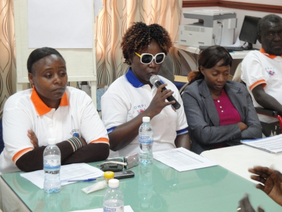 Roseweter Mudarikwa  speaks into a microphone
