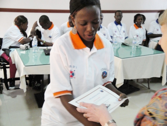 Gloria Namureme is handed a certificate by Marcia Rioux