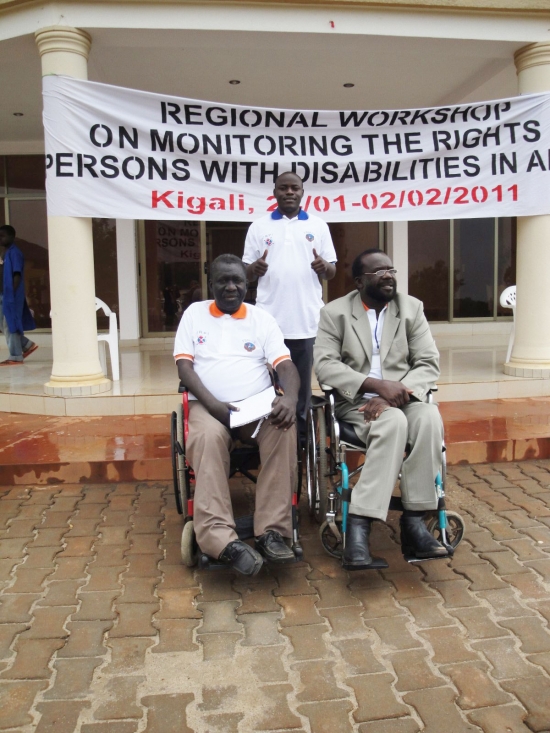 <p>
	Mohamed Fall (left), Tambo Camara (right) and Oswald Tuyizere (behind) pose for a photo outside the hotel entrance</p>
