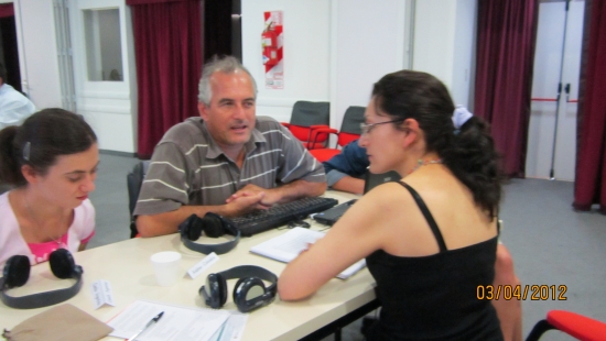 <p>
	Naziberto Oliveira, Camila Albin and Andrea Cortes during interview practice. All three participants are seated at a table facing each other.</p>
