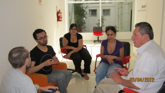 <p>
	Jos&eacute; Leal, the two sign interpreters, Laura Lemura and Germ&aacute;n Sciurano sit facing each other during interview practice.</p>
