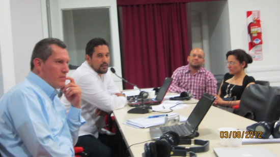 <p>
	Jos&eacute; Leal, Salam Gomes, Andrea Cortes and Guilllermo Pinilla seated at a table during training. Salam is reporting back to the larger group.</p>
