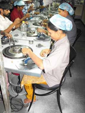 <p>A woman working among others at her workstation at Rajiv Gems Park</p>
