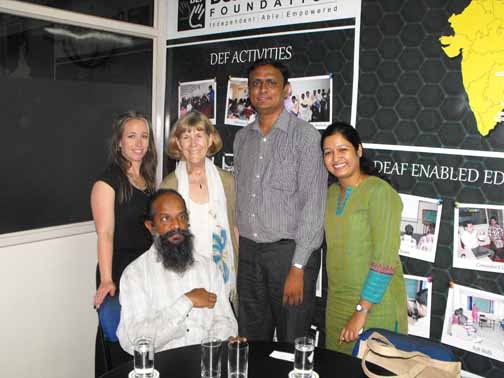 <p>Alexis Buettgen and Marcia Rioux pose with representatives of the Deaf Enabled Foundation and Pavan Muntha.</p>
