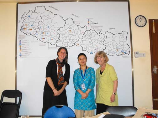 <p>Paula Hearn, a staff person from Handicap International, Nepal and Marcia Rioux &nbsp;posing in front of a whiteboard with a &nbsp;map.</p>
