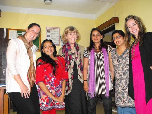 <p>Paula Hearn, Marcia Rioux and Alexis Buettgen pose indoors with women from Nepal Disabled Women&#39;s Network</p>
