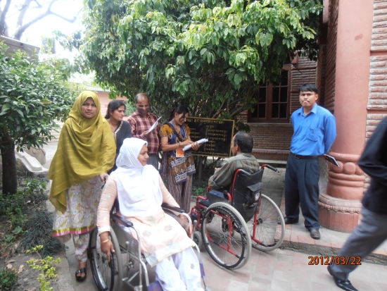 <p>
	At the side of the hotel Misty and Lucky (left) wait beside a group that meet their guest interviewee for the first time.</p>
