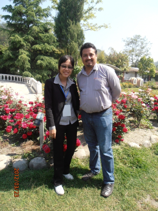 <p>
	Chenntay (left) and Kumar (right) are standing beside the rose garden to have their picture taken.</p>
