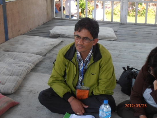 <p>
	Tula sits cross-legged as he takes part in an interview session.</p>
