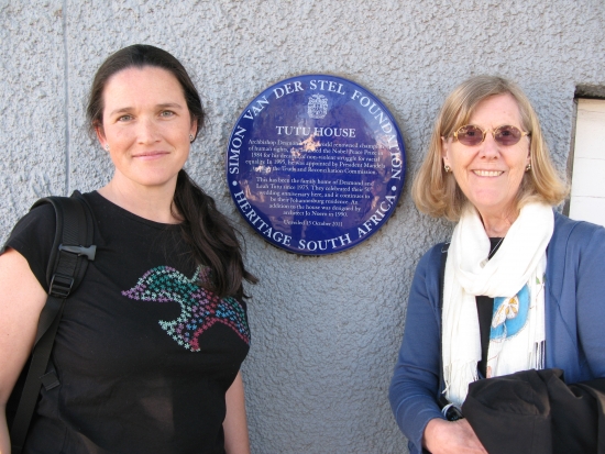 Rita Samson and Marcia Rioux taking a photo at Mendela's house. 