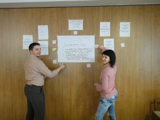 Marko Stojanovic and Sanja Smajic are busy putting up posters for the evening activity.