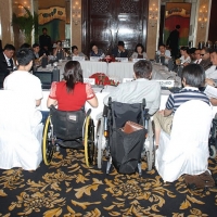 <p>
	The regional council members are seated around a large rectangular table.</p>
