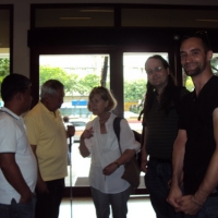 Five people are in this photo, three are facing the camera and two are looking at the others in the photo. They might have been having a conversation when the photographer took the photo. The people are: Christopher Lytle (right), Nathan Bond 
(2nd from right),Marcia Rioux (centre), Lauro Purcil (2nd from left) & Ranil Sorongon (left). 