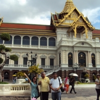 Chona Sabo (left) with Lauro Purcil (middle) and Ranil Sorongon (right) of the Philippines pose in front of the Grand Palace. 