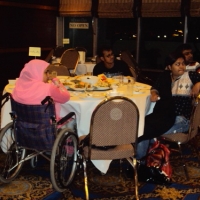 Participants sit around a table with food: Ashrafun Nahar (left), Roosevelt D'Rozario (2nd from left), Farhana Mustary (right) and MD Rasel (behind Farhana). 