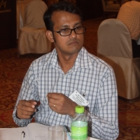 Roosevelt Benjamin D'Rozario of Bangladesh sits at a table. 