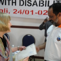 <p>
	Professor Marcia Rioux gives a certificate to Moosa Salie.</p>
