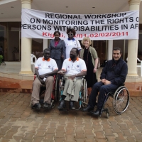Mohamed Fall, Tambo Camara, Mohamed El Khadiry, Professor Marcia Rioux, Roseweter Mudarikwa and her assistant pose together outside the hotel