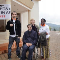 Chris Lytle, Marcia Rioux , Magdalena Kaihuzi and Mohamed El Khadiry pose outside the hotel