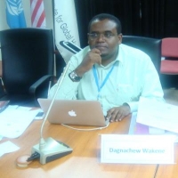 <p>Gentleman sitting behind desk</p>
