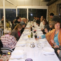 <p>
	Participants sit at a long table set for a meal in the restaurant in Novi Kneževac.</p>
