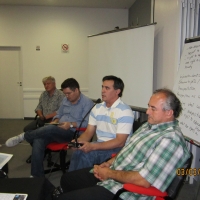 <p>
	Domingos Montagna, Alexandre Mapurunga, and Naziberto Oliveira sit as Ronaldo Bacry reports on Brazil. There are a number of flip charts visible behind them.</p>
