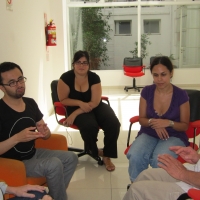 <p>
	Jos&eacute; Leal, the two sign interpreters, Laura Lemura and Germ&aacute;n Sciurano sit facing each other during interview practice.</p>
