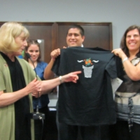<p>
	Marcia Rioux is handing the DRPI tee-shirt to Jose Viera during the closing ceremony. Paula Pinto and Ver&oacute;nica Gonz&aacute;lez are on the side.</p>

