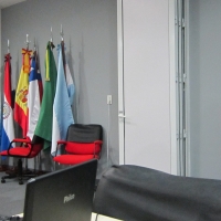 Marcia Rioux speaking during final day of the training. Marcela Omedo is on the left, sitting at her table and listening.