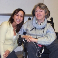 Iphigenia (left) and Sandra (right) smile as they have their photo taken.