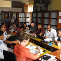 <p>NFDN Board Members and DRPI staff sitting around a table for a board meeting</p>
