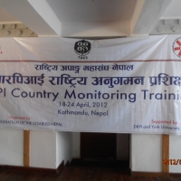 <p>
	The banner at the front of the training room reads &quot;DRPI Country Monitoring training. Kathmandu, Nepal. April 18-24th.&quot;</p>

