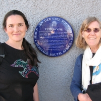 Rita Samson and Marcia Rioux taking a photo at Mendela's house. 