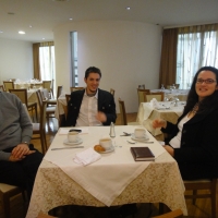 During a discussion at breakfast Chris Lytle, Rados Keravica and Rita Samson pose for a photo. 