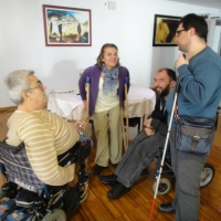 The four members of the project team have a meeting at the side of the training. 