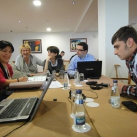 Marina Vujačić, Slavica Zoric, Ana Macanovic , Andrija  Marićević sit together at a table, discussing interviews as a group. 