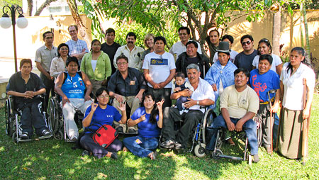 Training participants pose outside for a group photo.