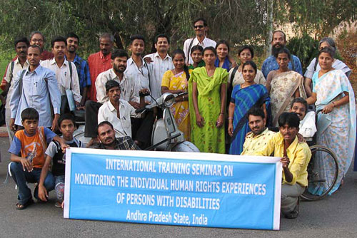 A outdoor group shot of participants of the International Training Seminar on Monitoring Human Rights Experiences of Persons with Disabilities in Andhra Pradesh State, India